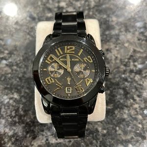 Used Michael Kors watch. Shows signs on wear. Needs a new battery